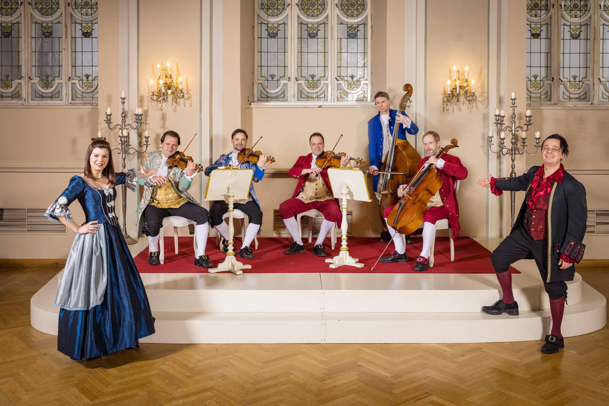 Mozart Dinner Concert ensemble in historical costumes performing in Salzburg’s Baroque Hall