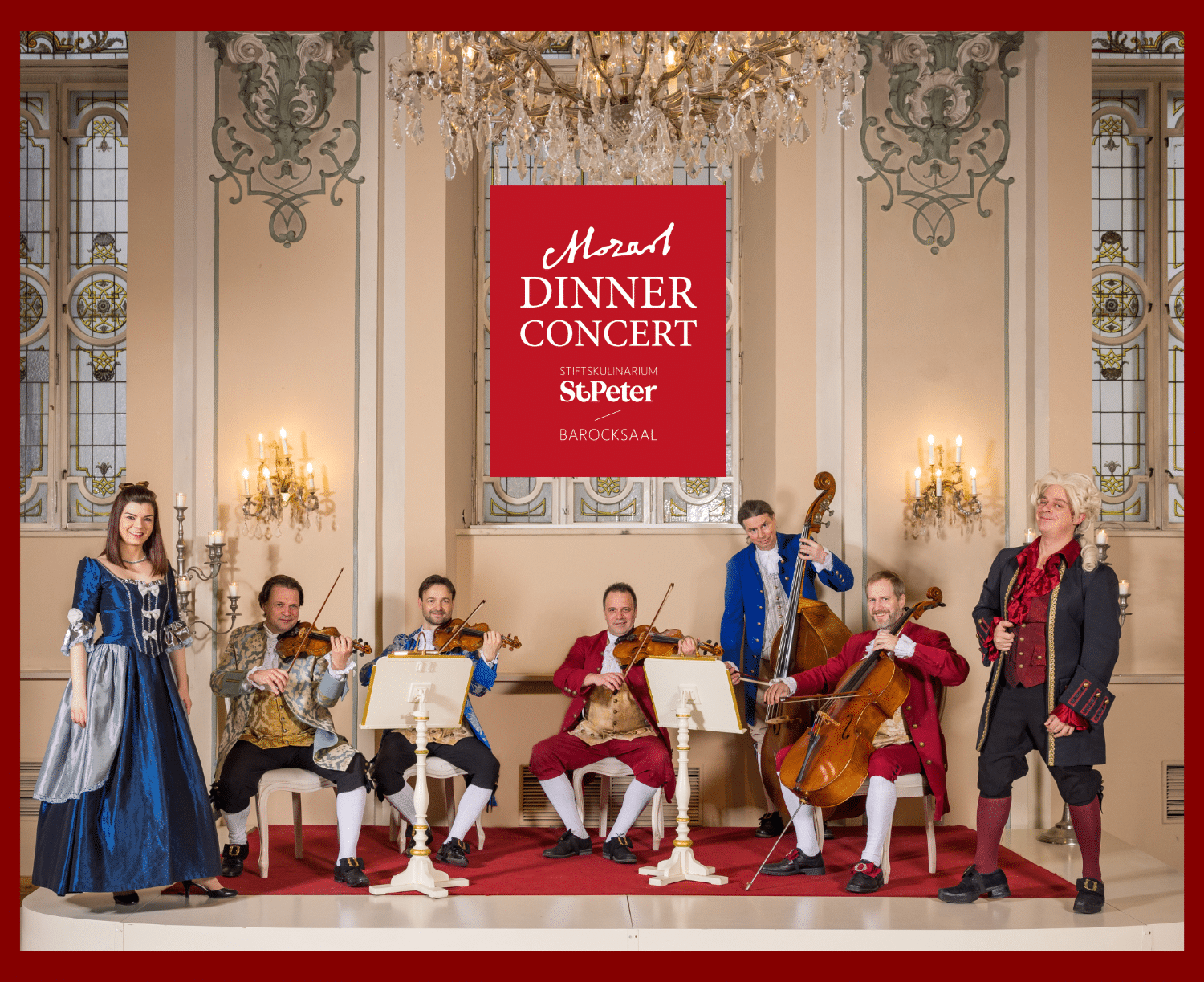 Mozart Dinner Concert im historischen Barocksaal St. Peter in Salzburg mit Musikensemble in barocken Kostümen und klassischem Konzertambiente.