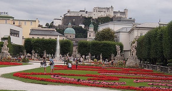 Hop-On Hop-Off Salzburg stop at Mirabell Gardens with view of Hohensalzburg Fortress